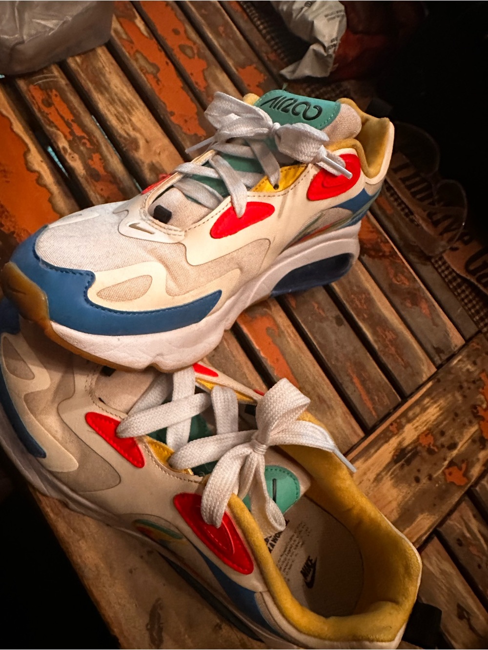 Nike Women's White Athletic Sneakers with Blue, Red and Yellow Accents